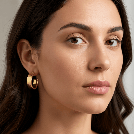 Brede RVS Oorringen Glad Glanzend Goudkleur 23mm x 7mm - Aramat Jewels - Oorringen - cadeautip