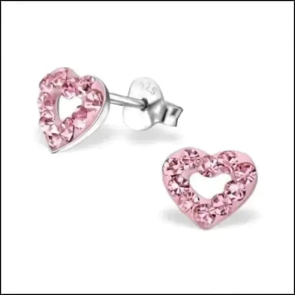 a pair of scissors and a pink ribbon