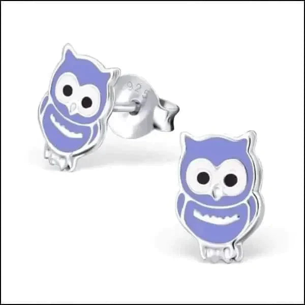 a blue and white toy elephant with a face