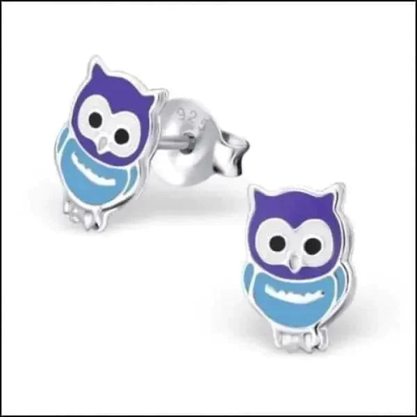 a blue and white toy elephant with a face