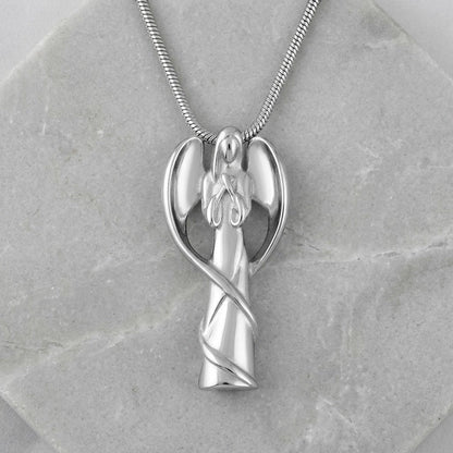Aramat Jewels silver-colored stainless steel angel ash pendant with wings and a swirling ribbon detail. Symbolizes protection and comfort.