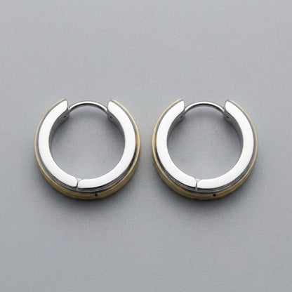 Aramat Jewels stainless steel huggie hoop earrings with a bicolor design featuring silver and gold stripes.