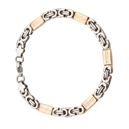 Aramat Jewels bicolor stalen koningsarmband met kruisjes, 7mm breed en 22cm lang, zilverkleurig en goudkleurig.