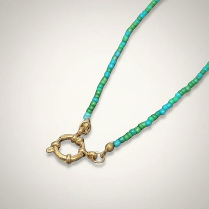 Aramat Jewels blue and green beaded charm necklace with gold clasp. Handmade RVS and Rocailles.