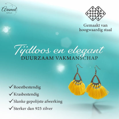 Aramat Jewels boho oorhangers met gele kwastjes en bronskleurig metaal, ideaal voor een zomerse festival look.