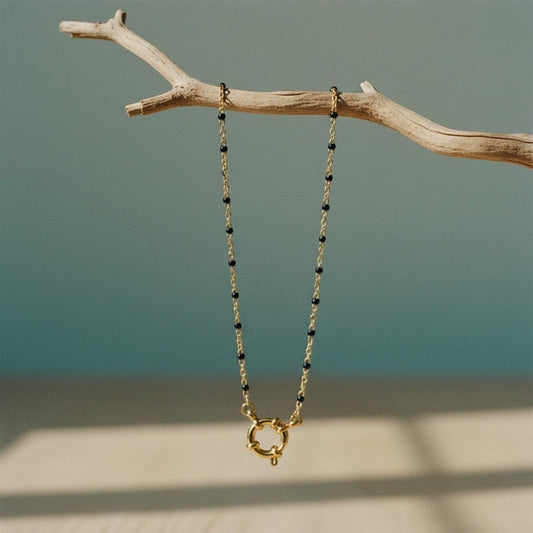 Aramat Jewels gold chain necklace with small black enamel beads and a unique gold clasp.