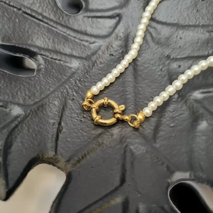Aramat Jewels gold-tone clasp on a delicate white pearl bead necklace, 42cm length.