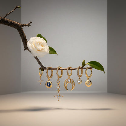 Aramat Jewels gold-plated 925 silver earrings set with stars, moons, and cubic zirconia.
