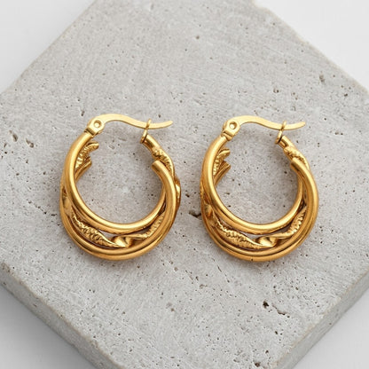 Aramat Jewels gold-tone stainless steel 3-in-1 hoop earrings with twist detail, 20mm diameter.