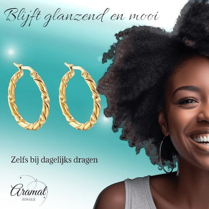 Aramat Jewels gold-coloured twisted hoop earrings, 35mm diameter, made of stainless steel with a swirl design.