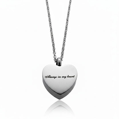 Aramat Jewels silver-tone stainless steel heart-shaped cremation pendant with "Always in my heart" engraving, on a 50cm chain.