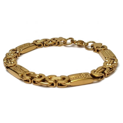 Goudkleurige koningsschakel armband van edelstaal met kruisjes, 21cm lang en 8mm breed.