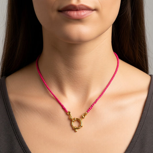 Aramat Jewels gold-tone necklace with a bright pink beaded chain and a circular clasp, 42cm long.