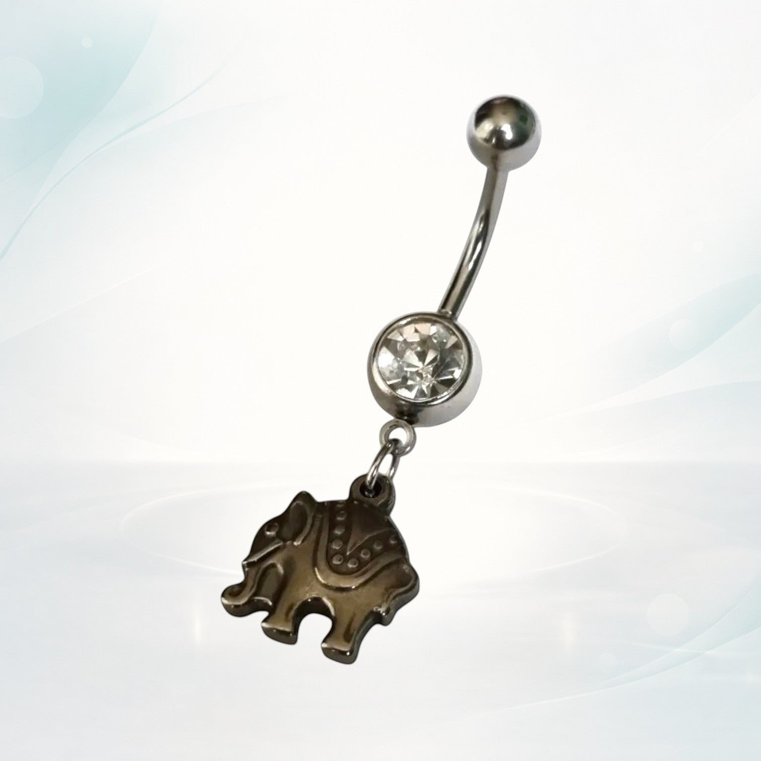 Aramat Jewels silver surgical steel belly button piercing with a detailed elephant charm and clear cubic zirconia.