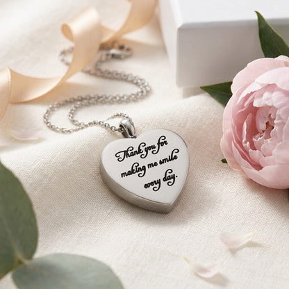 Aramat Jewels silver stainless steel heart-shaped cremation pendant engraved with "Thank you for making me smile every day".