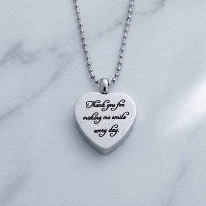 Aramat Jewels silver stainless steel heart-shaped ash pendant with "Thank you for making me smile every day" engraved.
