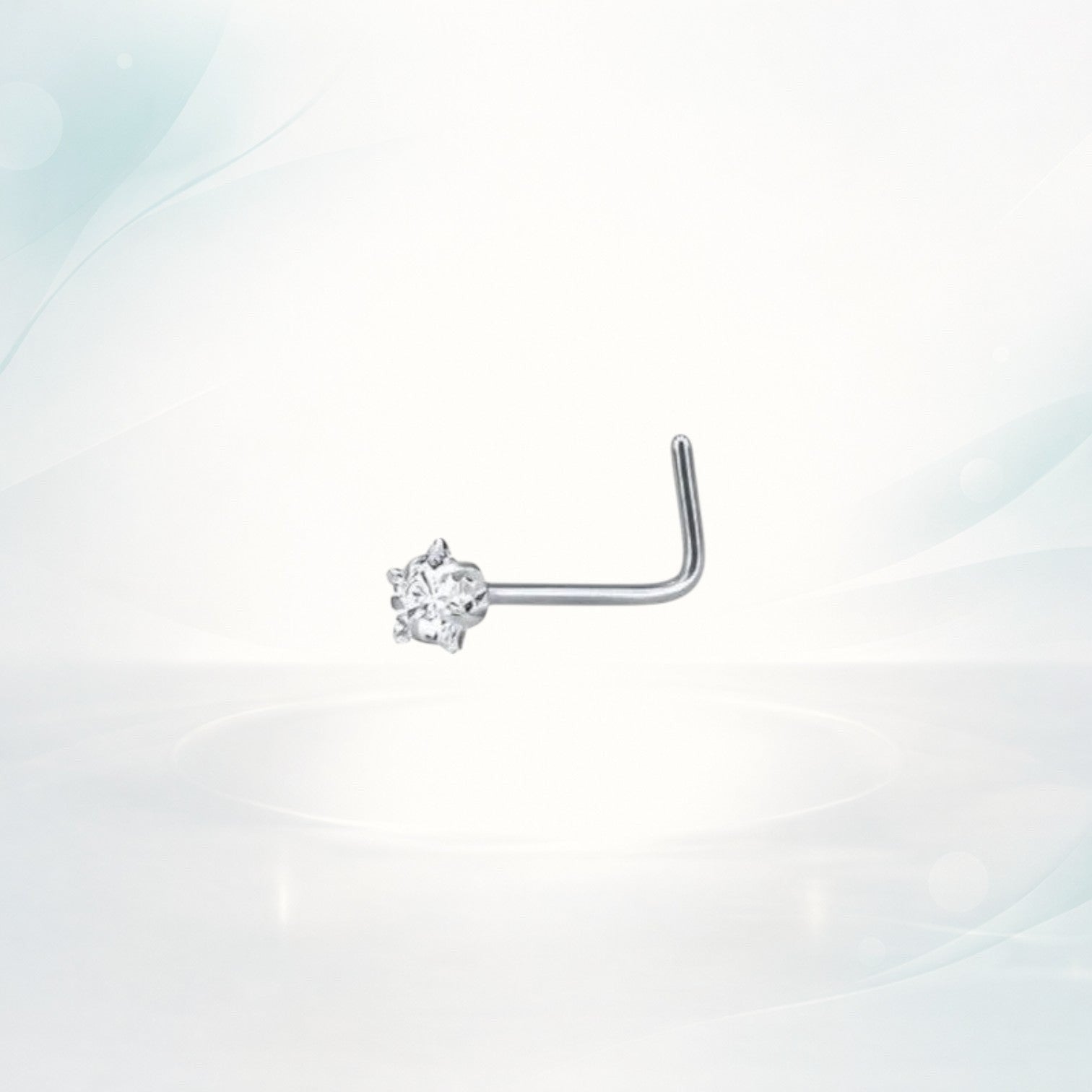 Aramat Jewels silver L-shaped nose piercing with a clear cubic zirconia stone.