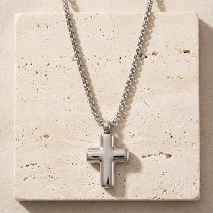 Aramat Jewels silver-coloured 316L steel cross cremation pendant, 2x1.5cm, with a simple box chain.