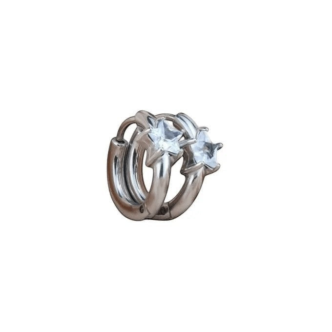 Aramat Jewels silver-tone steel hoop earrings with star-shaped clear cubic zirconia accents.