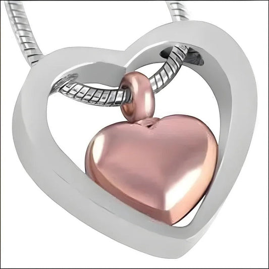 Aramat Jewels stalen hart crematiehanger in zilverkleurig en rosékleurig. Gedenksieraad met hartvormige binnenhanger.