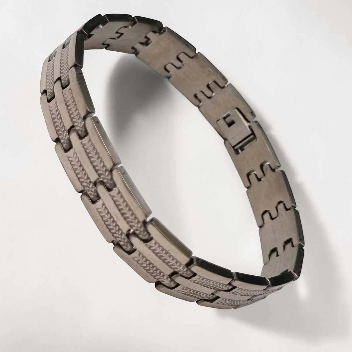 Aramat Jewels zilverkleurige stalen schakelarmband van 21cm met een fantasie schakelpatroon.