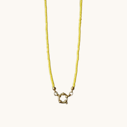 Aramat Jewels yellow beaded necklace with gold clasp, handmade from Rocailles beads and stainless steel.