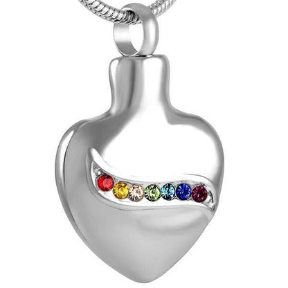 Aramat Jewels zilverkleurige stalen hartvormige ashanger met een lijn van gekleurde zirkonia's, 32mm.