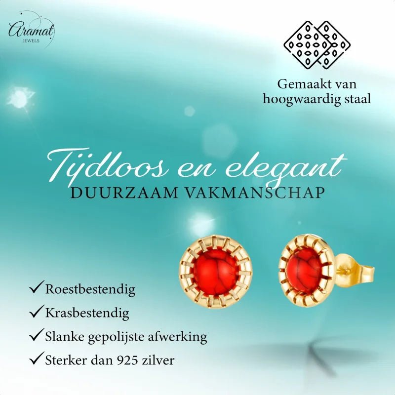 Goudkleurige oorbellen met rode stenen.