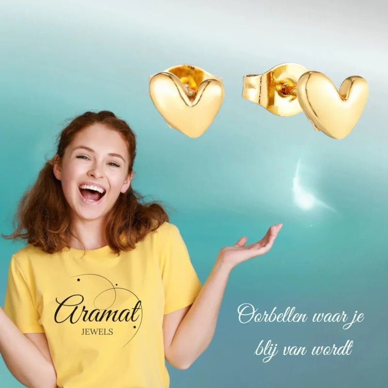 Gouden hart oorbellen.