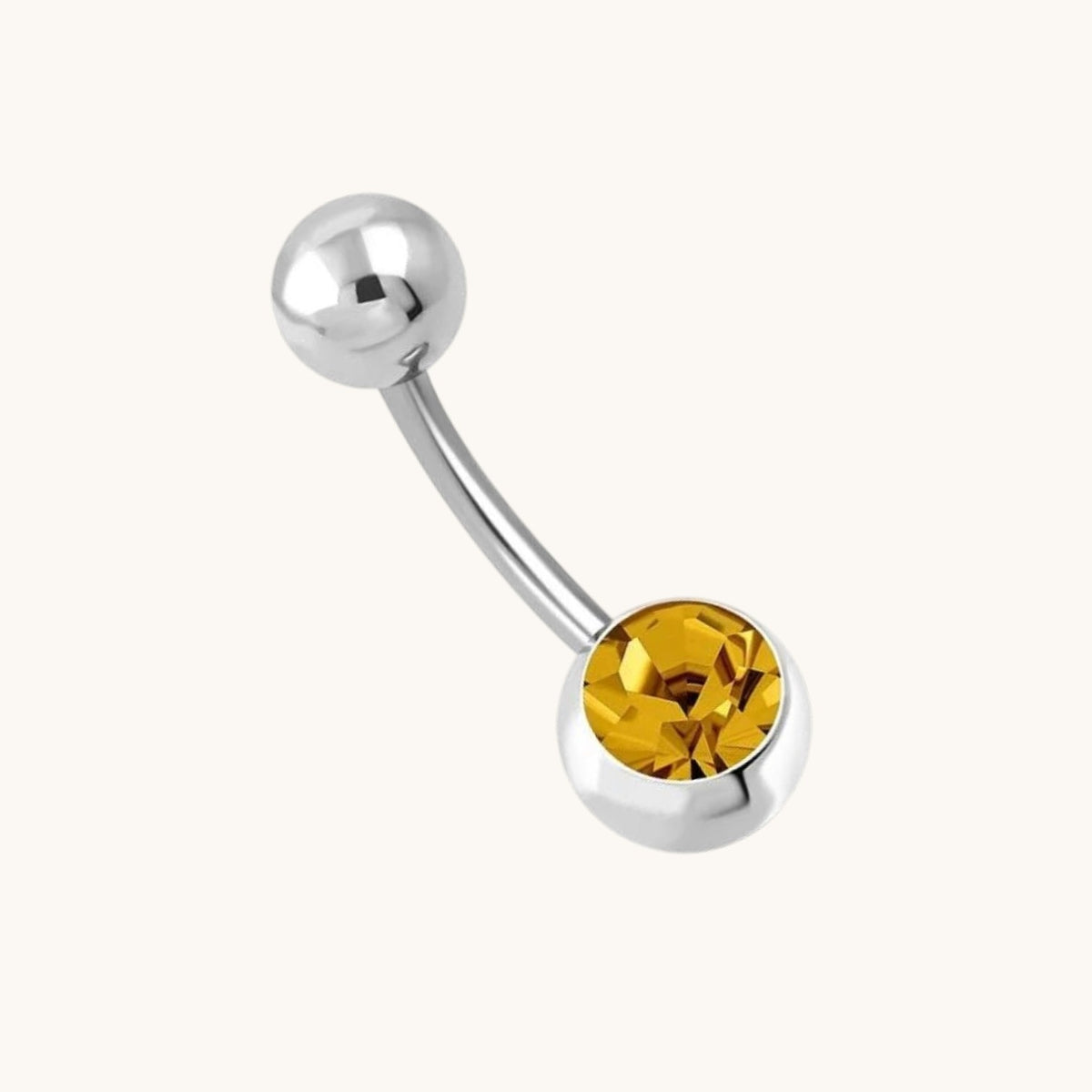 Orange-brown steel navel piercing with zirconia