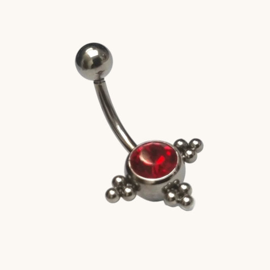 Piercing nombril en acier et zircon rouge avec points argentés