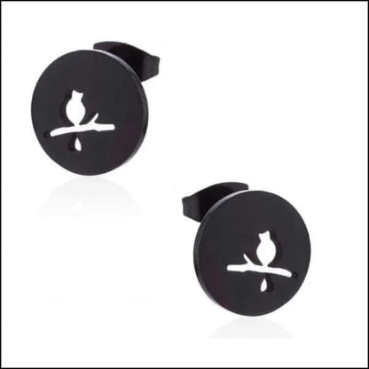 Een paar zwarte kattensilhouetten op een witte achtergrond