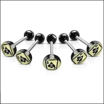 Aramat Jewels surgical steel tongue piercing with black acrylic balls and a spade logo on a light yellow background.
