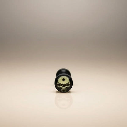 Aramat Jewels surgical steel tongue piercing with black acrylic logo featuring a skull design. Available in multiple colors.