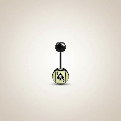 Aramat Jewels surgical steel tongue piercing with black acrylic balls and spade logo design on a light yellow background.
