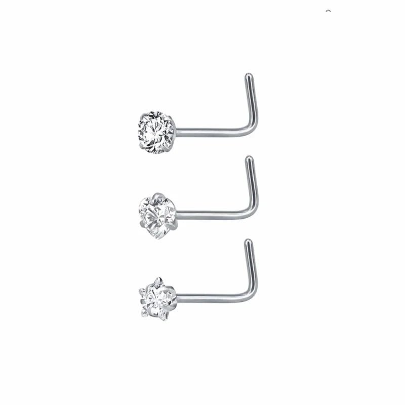 Drie paar neusringen met hokjes erop