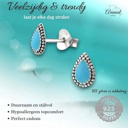 Turquoise oorbellen in de vorm van een druppel.