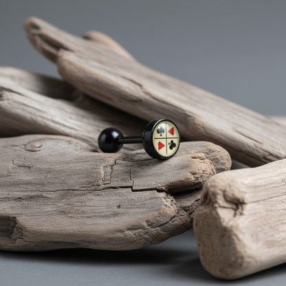 Aramat Jewels black bioplast tongue piercing with card suit symbols and a black ball end.